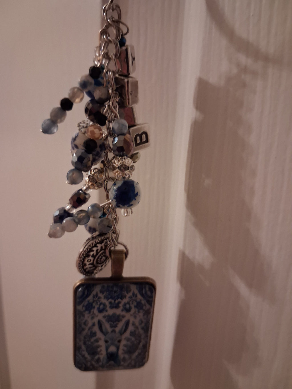 Delft donkey purse dangle hanging naturally