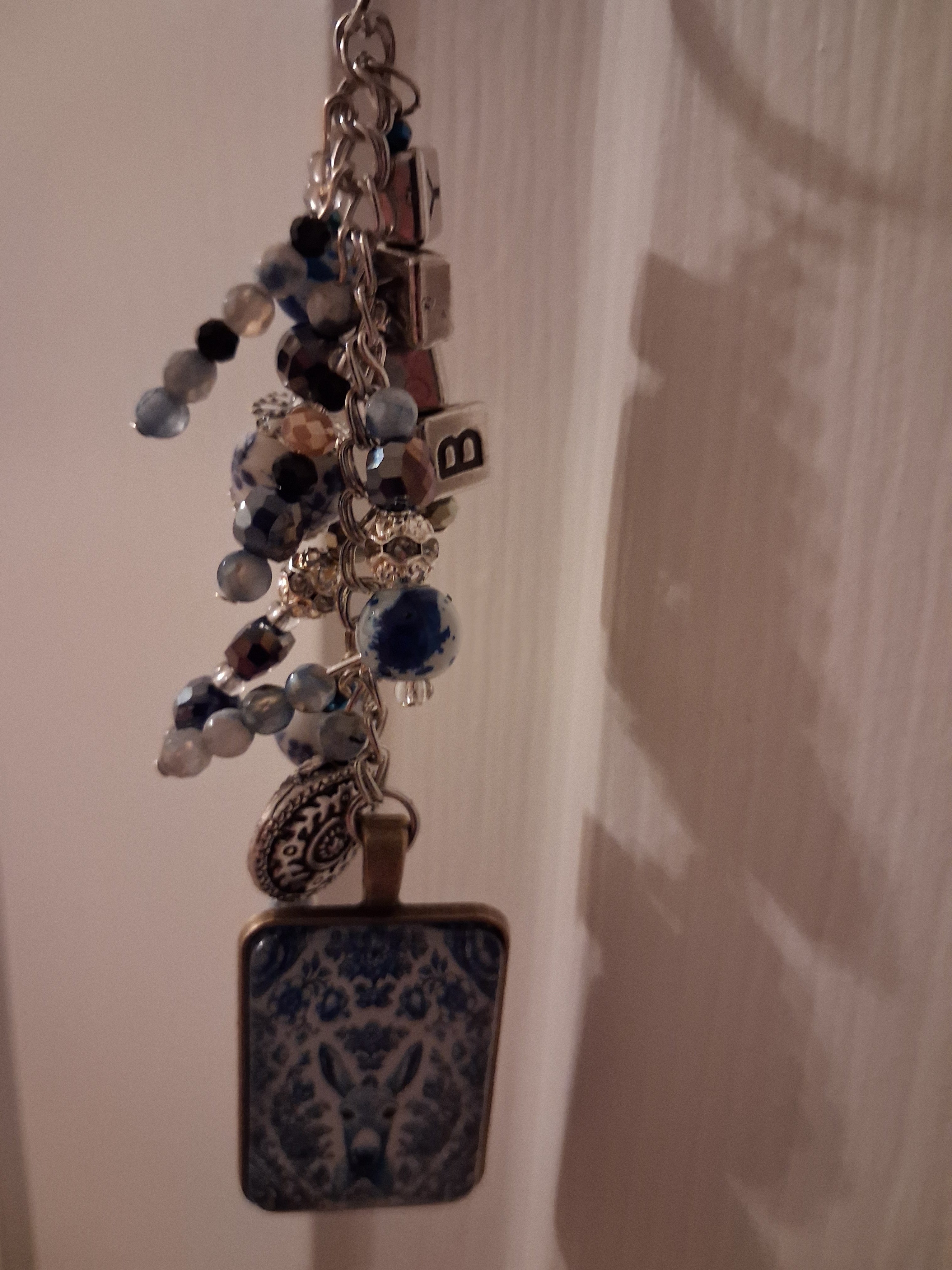 Delft donkey purse dangle hanging naturally