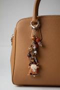 Highland cow dangle on tan leather purse