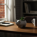 Small pig planter on desk high contrast